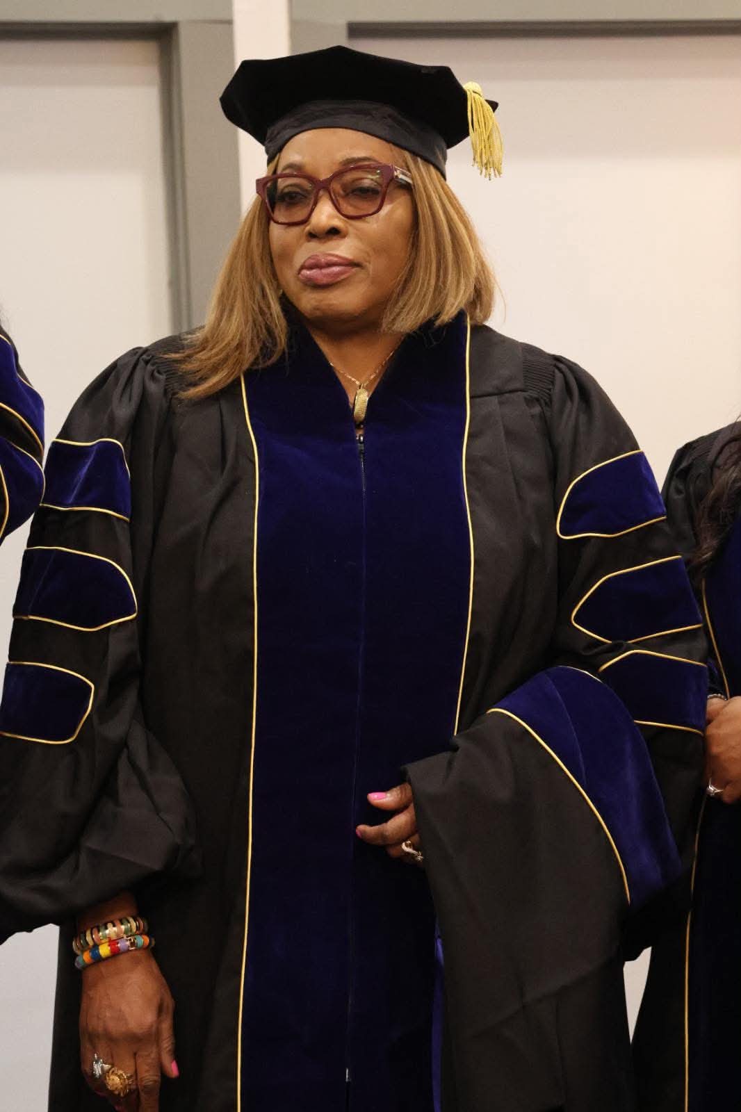 Zoe Christian University leader in doctoral regalia