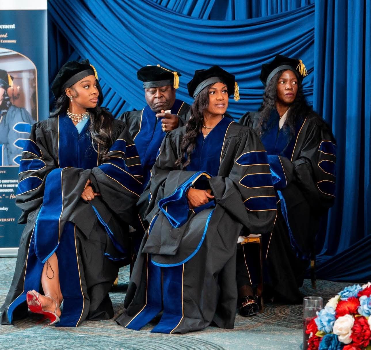 Graduates seated on stage during the ceremony
