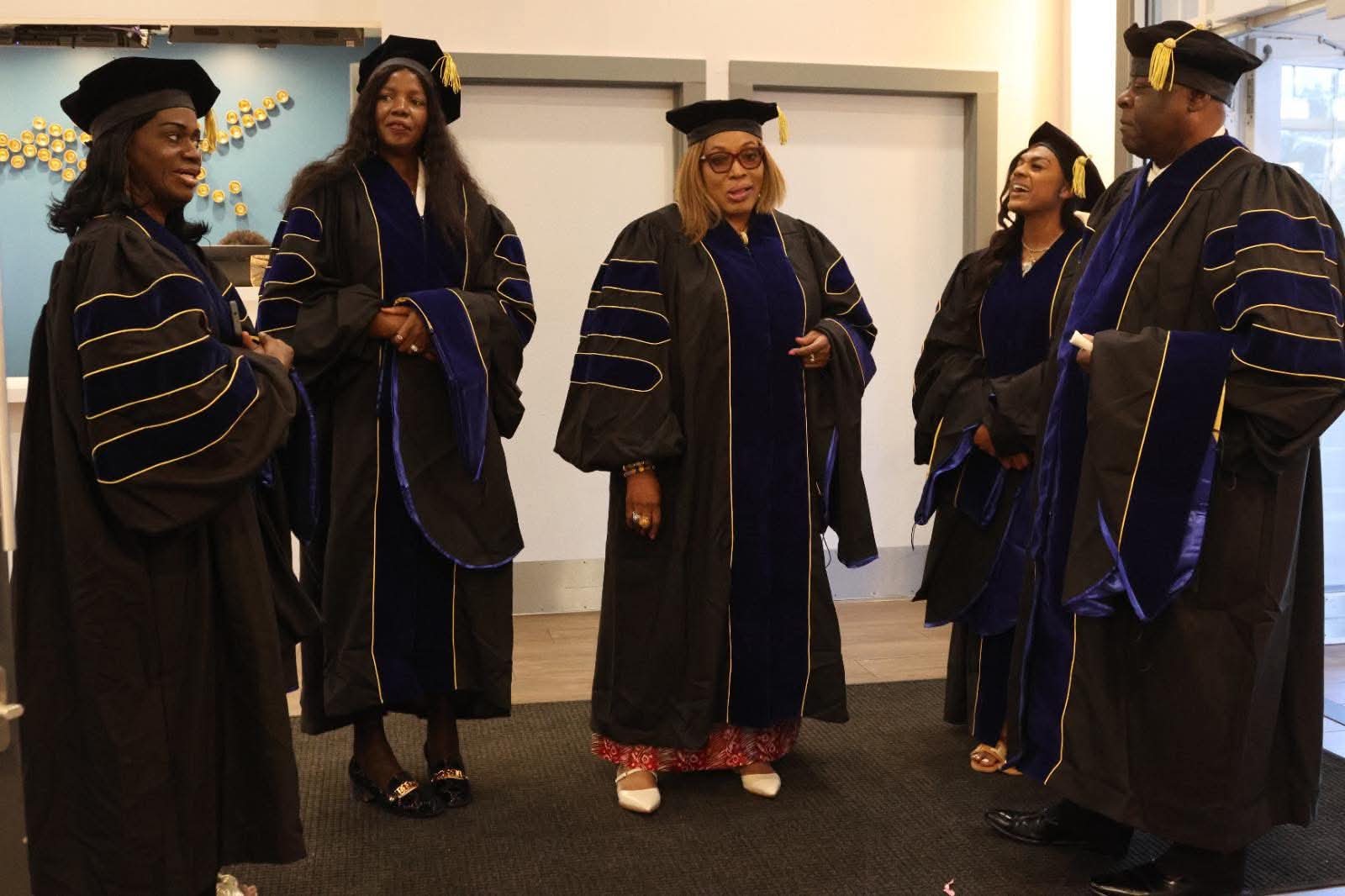 Graduates gathered in regalia before the processional